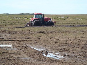 A turf contractor extracting peat from the Roundstone Bog, Special Area of Conservation in Co. Galway